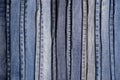 Denim. Blue jeans background. Stack of blue jeans different shadows