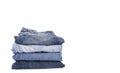 Denim blue jeans stack on white background. Clothes, fashion, charity Royalty Free Stock Photo