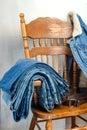 Denim clothes on a vintage armchair Royalty Free Stock Photo