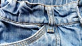 Denim is a coarse,tough,dense twill weave, from which classic jeans are sewn.Jeans dyed in traditional indigo blue.The seams are Royalty Free Stock Photo