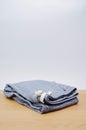 Denim cotton joggers with coulisse folded on a wooden table Royalty Free Stock Photo