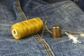 Denim fabric with needle, thread and thimble Royalty Free Stock Photo