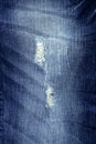 Denim fashion blue jeans broken fabric texture Royalty Free Stock Photo