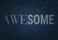 Denim jeans textile texture with the bleached inscription Awesome