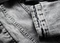 Denim texture close up. Light gray denim jacket sleeve Royalty Free Stock Photo