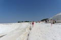 Denizli, Turkey. - July 20.2019. Tourists walk on a snow-white terraces at Pamukkale