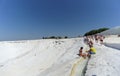 Denizli, Turkey. - July 20.2019. Tourists walk on a snow-white terraces at Pamukkale