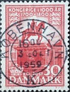 DENMARK - CIRCA 1955: A postage stamp from Denmark showing an equestrian statue of King Federik V. In front of Amalienborg Palace