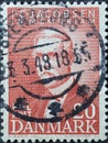 DENMARK - CIRCA 1947: A postage stamp from Denmark showing a portrait of J.C Jacobsen founder of the Carlsberg brewery for the 100