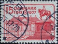 DENMARK - CIRCA 1937: A postage stamp from Denmark showing Amalienburg Castle with the equestrian monument to King Frederik V to m