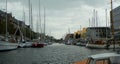 Denmark, Copenhagen, Overgaden Oven Vandet, view of the canal and yachts near the pier from the ship Royalty Free Stock Photo