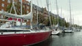 Denmark, Copenhagen, Overgaden Oven Vandet, view of the canal and yachts near the pier from the ship Royalty Free Stock Photo