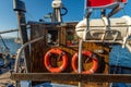 Denmark, Faaborg, 04-09-2021 old fishing cutter. lifebuoys, hanging on the wheelhouse Royalty Free Stock Photo