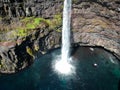 Denmark, Faroe Islands, Vagar Island, Gasadalur, village and waterfall falling into the sea