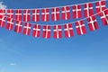 Denmark flag festive bunting hanging against a blue sky. 3D Render