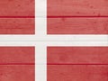 Denmark flag painted on wood plank background. Wooden texture flag of Denmark Royalty Free Stock Photo