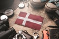 Denmark Flag Between Traveler`s Accessories on Old Vintage Map. Tourist Destination Concept Royalty Free Stock Photo