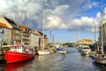 Denmark - Zealand region - Copenhagen city center - panoramic view of the Nyhavn district with boats and tenement houses along the Royalty Free Stock Photo