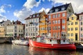 Denmark - Zealand region - Copenhagen city center - panoramic view of the Nyhavn district with boats and tenement houses along the Royalty Free Stock Photo