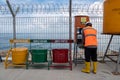 DENPASAR,BALI-DEC 24 2020: A construction project worker is resting and washing his hands. COVID 19 makes people have to obey Royalty Free Stock Photo