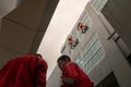 DENPASAR/BALI,INDONESIA-AUGUST 26 2019: Janitors or cleaning service were cleaning the window located at the height of a building