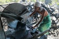 Denpasar, Bali, Indonesia, August 2020. Worker saws stone with circular saw for repairing. Power saw with disk