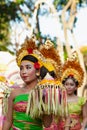 Procession of Balinese women in traditional sarongs carrying religious offering