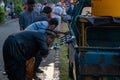 DENPASAR/BALI-JUN 05 2019: Muslims are performing ablution in a portable tap before performing Eid prayers in the Renon Bali field