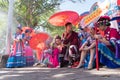 DENPASAR/BALI-JUNE 15 2019: The dancers from Yunan-China, wearing colorful costume, were sitting waiting for their turn to appear