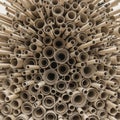A dense arrangement of tightly rolled cardboard tubes of various diameters, creating Royalty Free Stock Photo