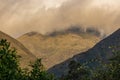 A dense cumulus cloud covers the top of the Iguaque mountain at sunset Royalty Free Stock Photo
