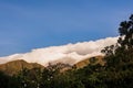 A dense cumulus cloud covers the top of the Iguaque mountain at sunset Royalty Free Stock Photo