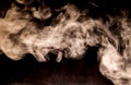 Dense Fluffy Puffs of White Smoke and Fog on Black Background, Abstract Smoke Clouds