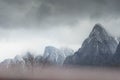 Dense fog over Bucegi mountains. Dreamy landscape Royalty Free Stock Photo