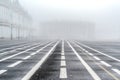 Dense fog on the Palace square of St. Petersburg retains the outlines of buildings Royalty Free Stock Photo