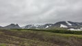 Dense gray clouds lie on the mountains.