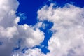 Dense white clouds on a beautiful summer blue sky Royalty Free Stock Photo