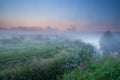 Dense morning fog and windmill Royalty Free Stock Photo