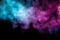 Abstract art colored blue and pink smoke on black isolated background. Royalty Free Stock Photo