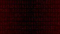 Dense Red Binary Array - Repeating Code Fragments on Dark Background Royalty Free Stock Photo