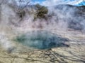 Dense steam coming from geothermal spring in Tokaanu Thermal park in Waikato region of New Zealand