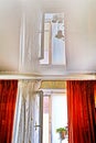 Dense textile and light openwork curtains used to protect windows from the sun. Background.