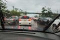 Dense traffic on a rainy day with raindrops on car glasses