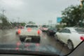 Dense traffic on a rainy day with raindrops on car glasses Royalty Free Stock Photo