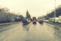 Dense traffic on a rainy day. Traffic in rainy day with road view through car window with rain drops. Blurry image, Rain Royalty Free Stock Photo