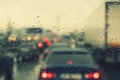 Dense traffic on a rainy day. Traffic in rainy day with road view through car window with rain drops. Blurry image, Rain drops on Royalty Free Stock Photo