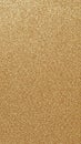 A close up view of a textured golden glitter surface with tiny sparkling particles creating a shimmering and background effect Royalty Free Stock Photo