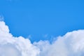 Dense white clouds on a blue background with copy space