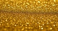 A densely packed array of golden glitter particles creates a sparkling, textured