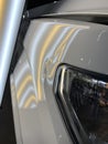 A dent on a front fender of a pickup truck. Royalty Free Stock Photo